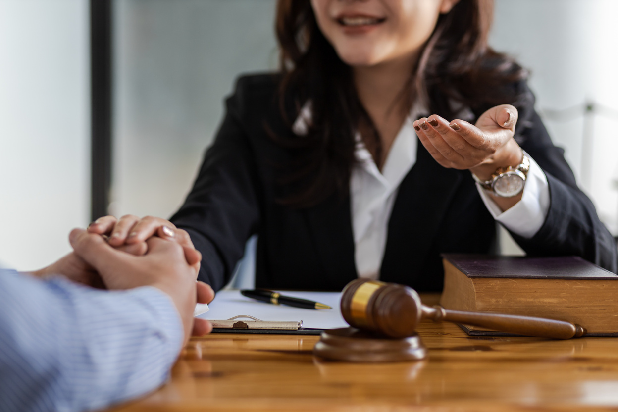 Female lawyer discussing law with businessman. Legal counsel and the concept of litigation mediation.